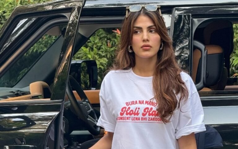 Rhea Chakraborty wearing a white t-shirt with the message 'Bura Na Mano Holi Hai,