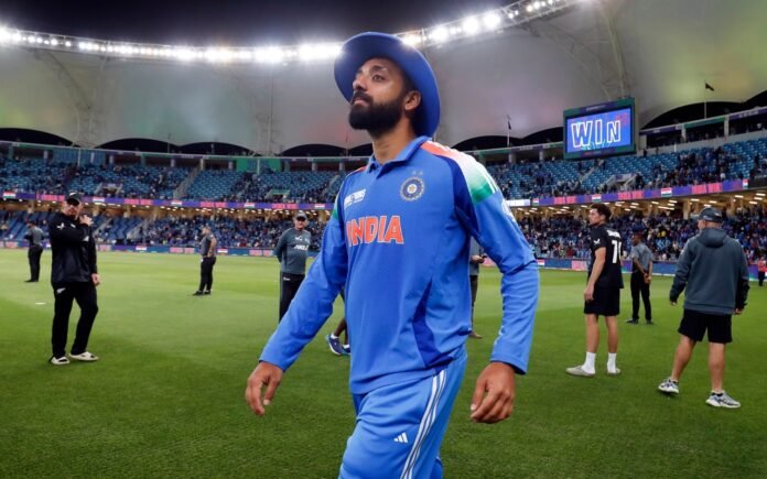 Varun Chakravarthy walks off the field after the match ends.