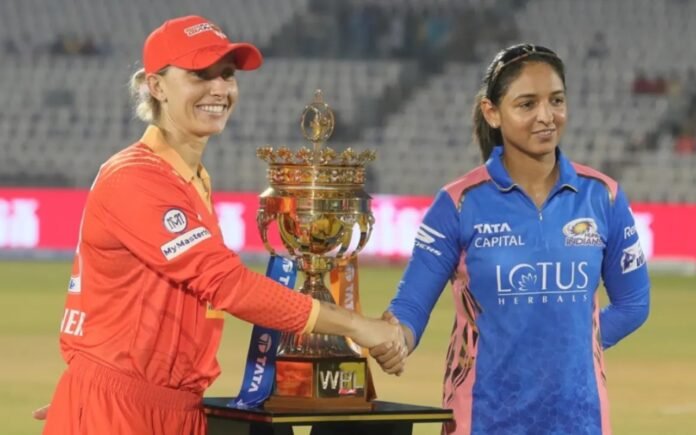 WPL 2025: Captains of Gujarat Giants and Mumbai Indians Women shake hands in front of the WPL trophy